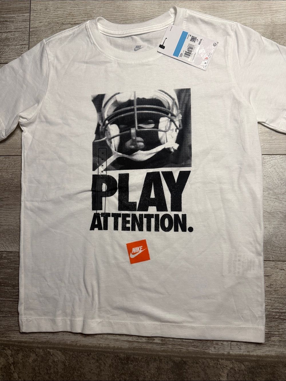 Nike White Tee with Black 'PLAY ATTENTION' Graphic & Orange Logo